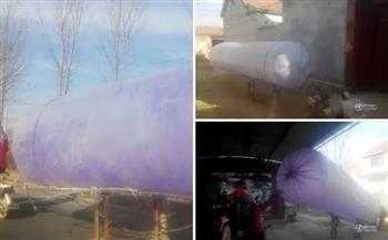 山東村民用6米長塑料袋灌天然氣回家 生火做飯